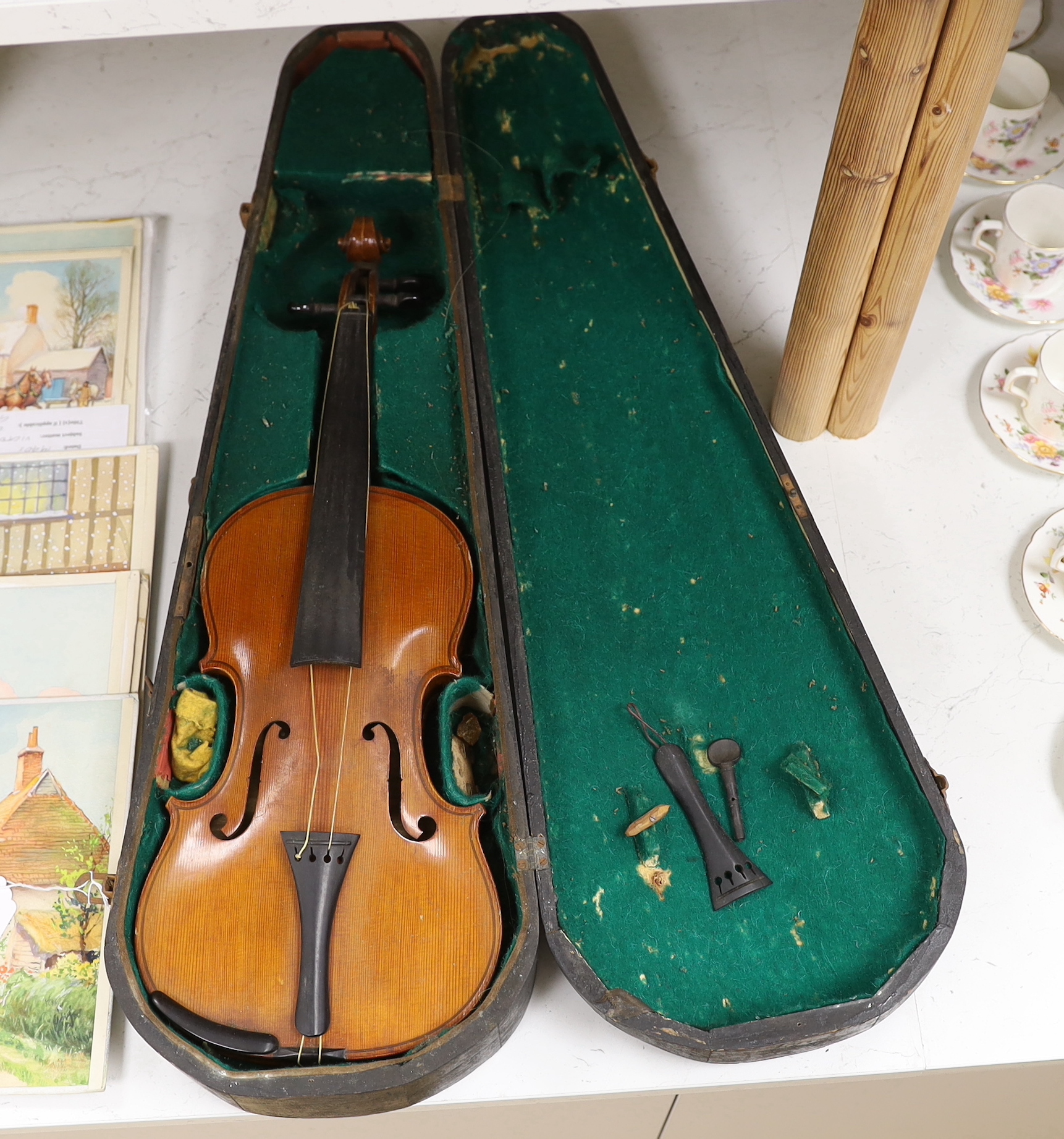 An early 20th century cased violin, length of the back 36cm